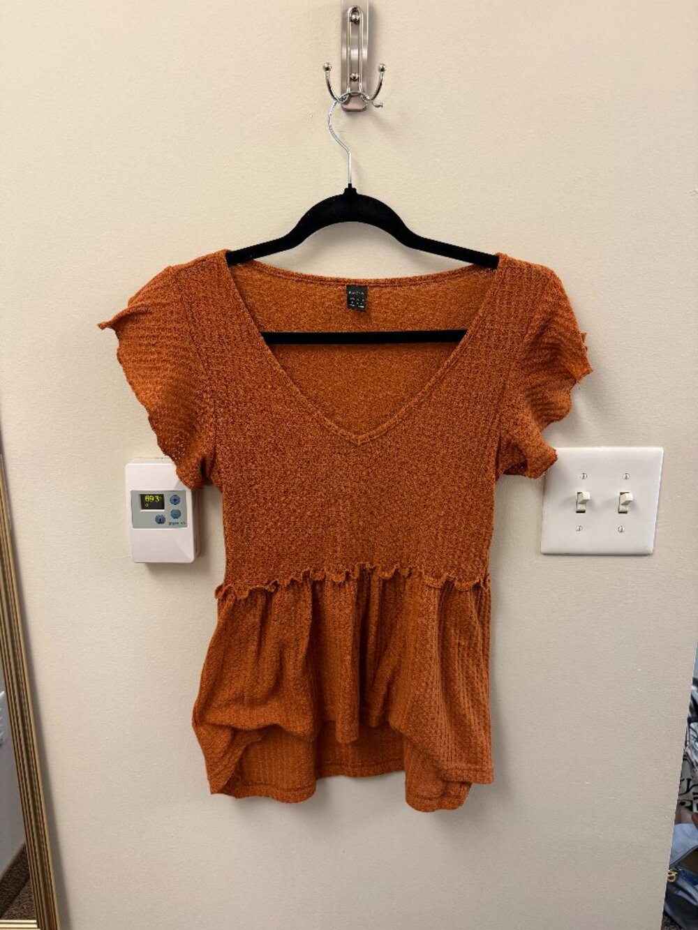 orange/brown top with textured fabric